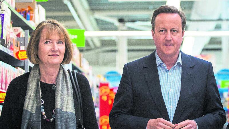 Prime minister David Cameron and former deputy Labour leader Harriet Harman speak to employees as they visit an Asda supermarket in Hayes, London. Picture by Jack Taylor &ndash; Pool/Getty Images 
