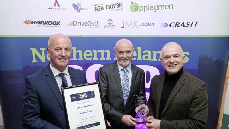 &nbsp;Hugh McIlhatton, pictured centre, from Disability Action collects his Lifetime Achievement Award from Paul Cooney of CRASH Services, pictured left, and Frank Mitchell