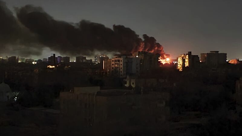 Smoke rises over the horizon as a fire burns after a strike in Khartoum, Sudan. Picture by AP Photo/Abdullah Moneim