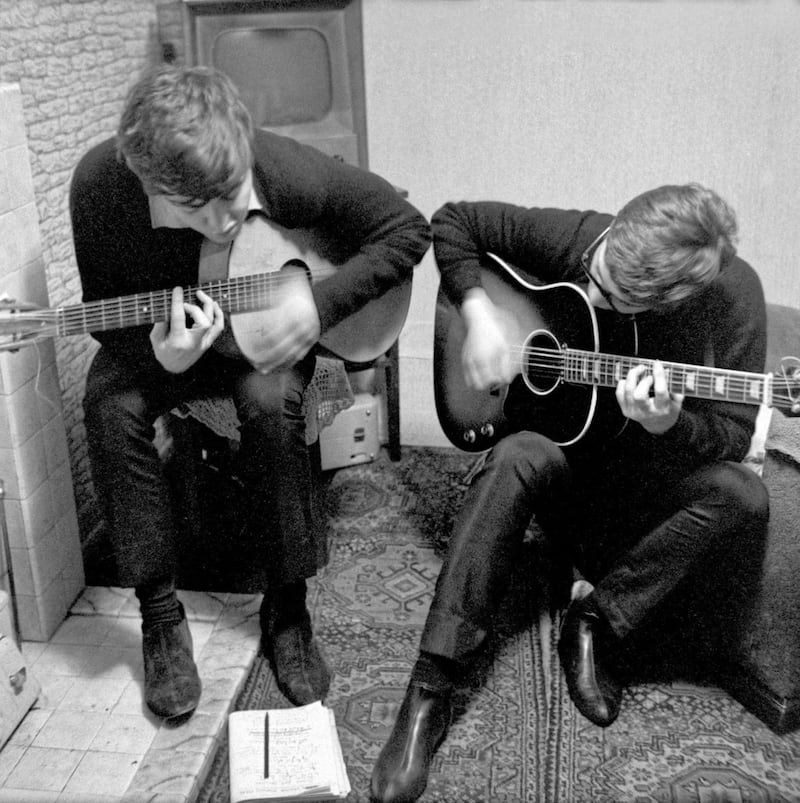 Paul with John Lennon writing &#39;I Saw Her Standing There&#39; in Paul&#39;s childhood home. Liverpool, 1962. Picture by Mike McCartney. &copy; Mike McCartney 