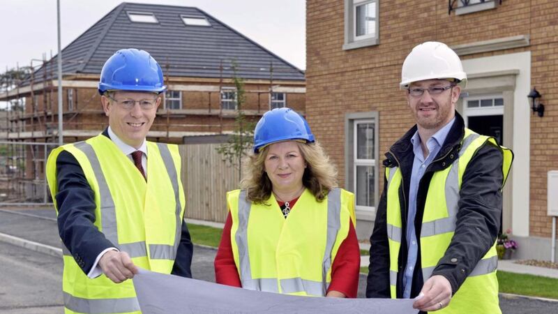Pictured at Co-Ownership&rsquo;s annual shared ownership month last year are the organisation&#39;s chief executive Mark Graham and customer services director Glynis Hobson with Tim McCauley, contracts manager of Windsor Developments Ltd, the developer behind the Hadlow scheme in Donaghadee 