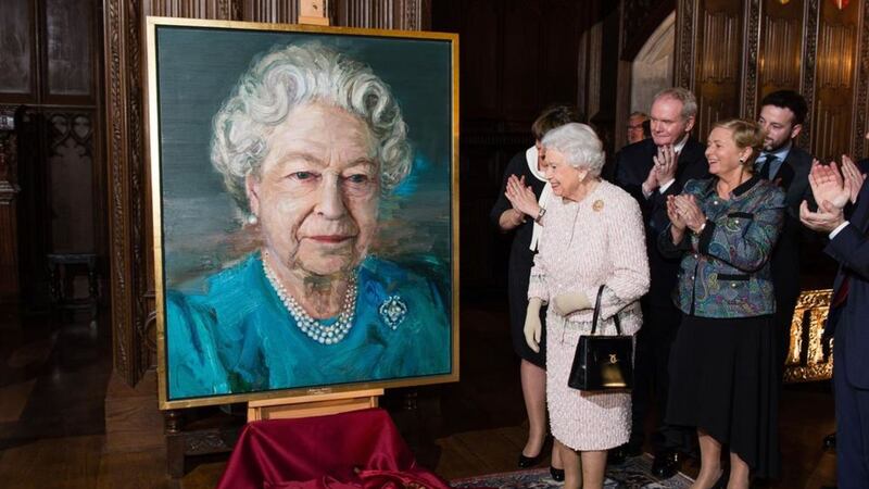 From left, Queen Elizabeth, Deputy First Minister Martin McGuinness, and Tanaiste Frances Fitzgerald at a Co-operation Ireland reception at Crosby Hall in London. The queen unveiled a portrait of herself by artist Colin Davidson. Picture by Jeff Spicer, Press Association