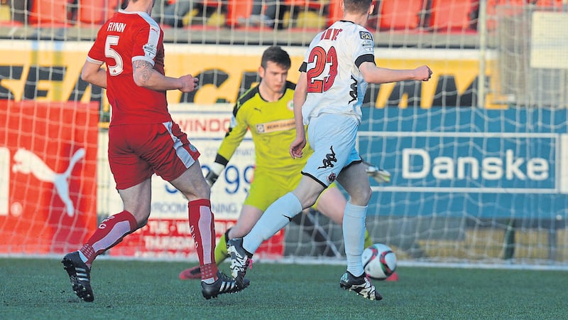 <address>Gavin Whyte fires home Crusaders&rsquo; first goal in their 3-1 victory over Cliftonville at Solitude last night which clinched a second successive league title for Stephen Baxter&rsquo;s men<br />Picture by Pacemaker