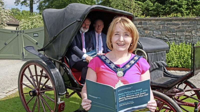 Newry Council chair Councillor Roisin Mulgrew launches the Preferred Options Paper consultation, watched by Garth Craig (chair of the planning committee and local development plan steering group) and Council chief executive Liam Hannaway. Picture: Bill Smyth 