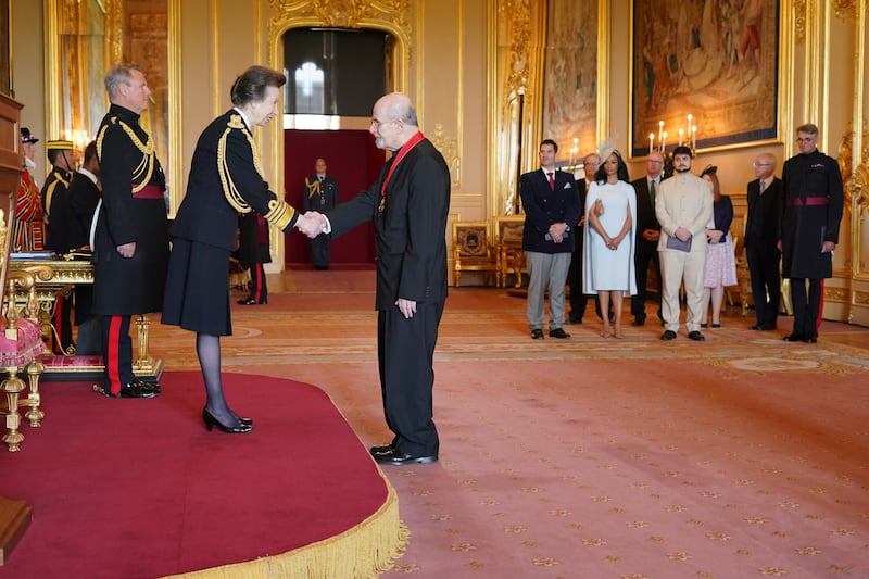 Sir Salman Rushdie is made a Companion of Honour by the Princess Royal at Windsor Castle
