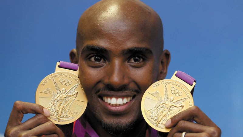 <span style="font-family: Arial, Verdana, sans-serif; ">Mo Farah poses with his two Olympic gold medals from London 2012, he hopes to win two gold again in Rio 2016</span>