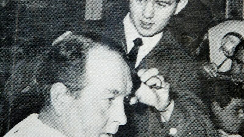 <span style="font-family: Arial, Verdana, sans-serif; ">Former Belfast Celtic legend Charlie Tully gets his hair cut by a young Marty Quinn while visiting Mickey Donnelly's barber shop on Donegall Street, Belfast</span>&nbsp;