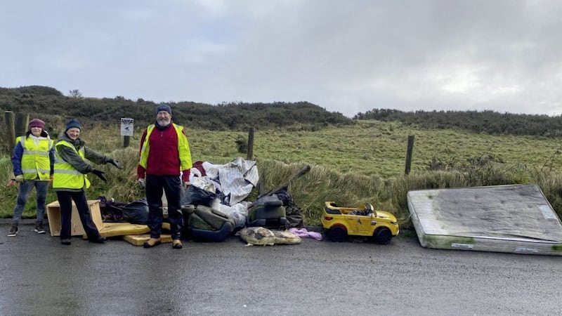 Volunteers from the Belfast Hills Partnership helping to gather rubbish dumped on Ballycolin Road. Picture from Belfast Hills Partnership 