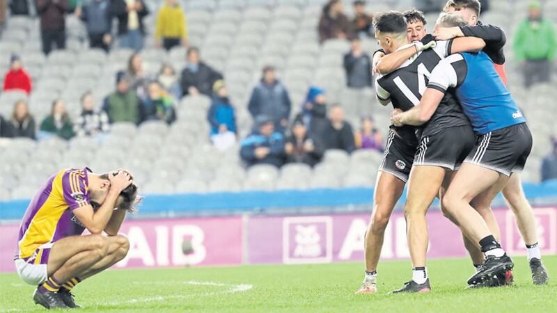 EMOTIONAL MOMENTS A Kilmacud player sinks to his knees while Kilcoo get ready to party at the end of Saturday&rsquo;s gripping All-Ireland Club SFC final at Croke Park