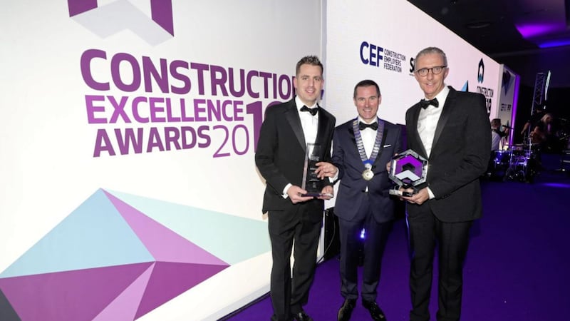 Pictured at the awards are CEF president Ray Hutchinson (centre) with Graham duo Gareth Brown and Gary Holmes 
