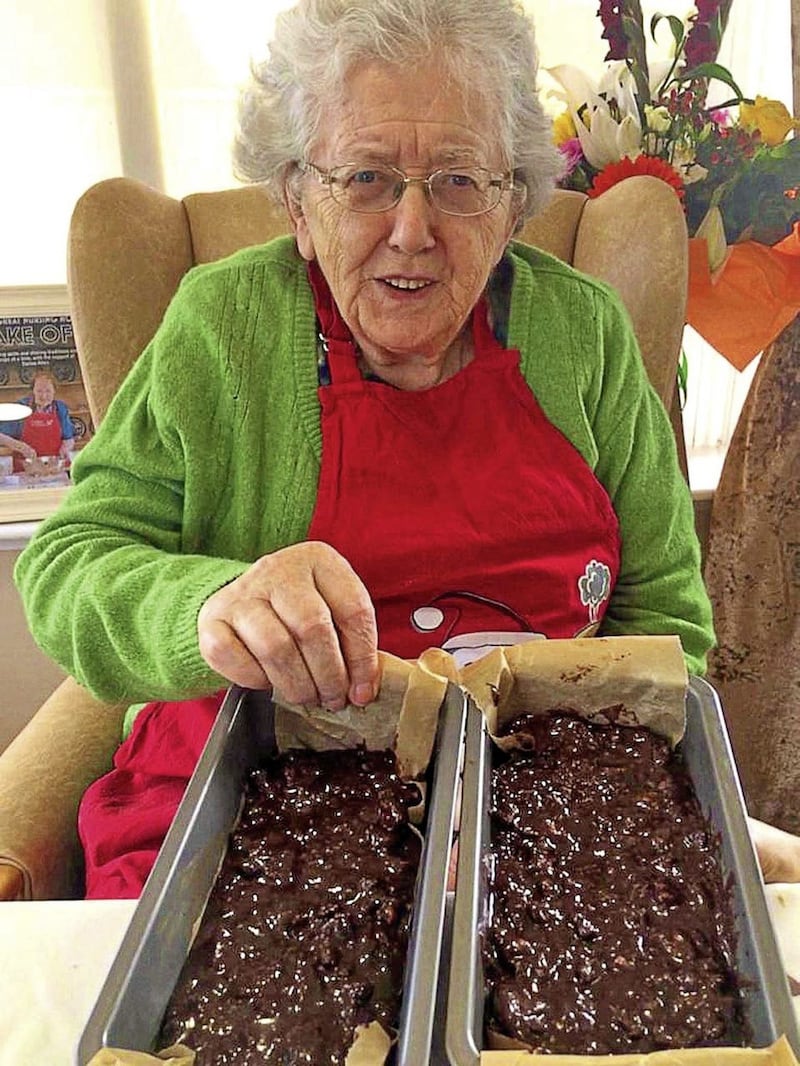 Margaret O&rsquo;Gorman shows off her Chocolate Biscuit Cake at St Martha&rsquo;s Nursing Home in Co Cork (Mowlam Healthcare/PA) 