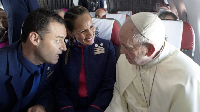 Pope Francis married flight attendants Carlos Ciuffardi and Paola Podest during a flight in Chile earlier this year. There has been controversy over whether the sacrament of marriage should be offered to Catholics who hold pro-abortion views. Picture by L&#39;Osservatore Romano Vatican Media/Pool Photo via AP 