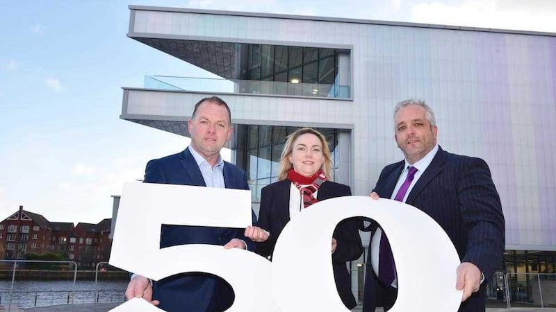 Stephen Thornton (Managing Director), Jenny Neeson (Finance Director) and Kenny Smyth (General Manager) from Thorntons who have announced a major recruitment and investment programme as part of their 50th year in business. In the background is the Belfast Waterfront Hall&#39;s new extension where Thornton installed cladding and soffits. 