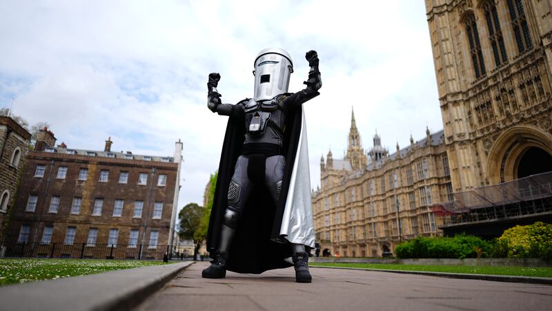 Mayor of London election candidate Count Binface poses outside Parliament in London.