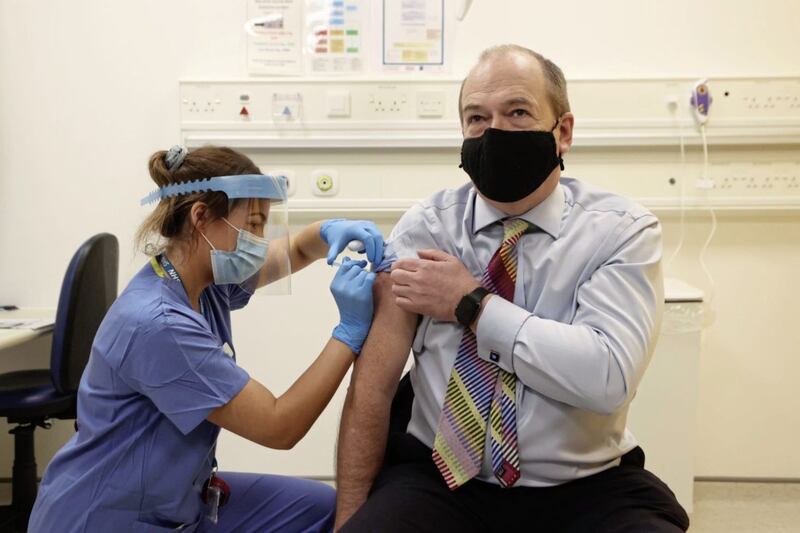 Chief Medical Officer Michael McBride receives the Oxford/AstraZeneca vaccine from nurse Alana McCaffery at the Ulster Hospital Covid-19 vaccination centre. Picture by Liam McBurney/PA Wire 