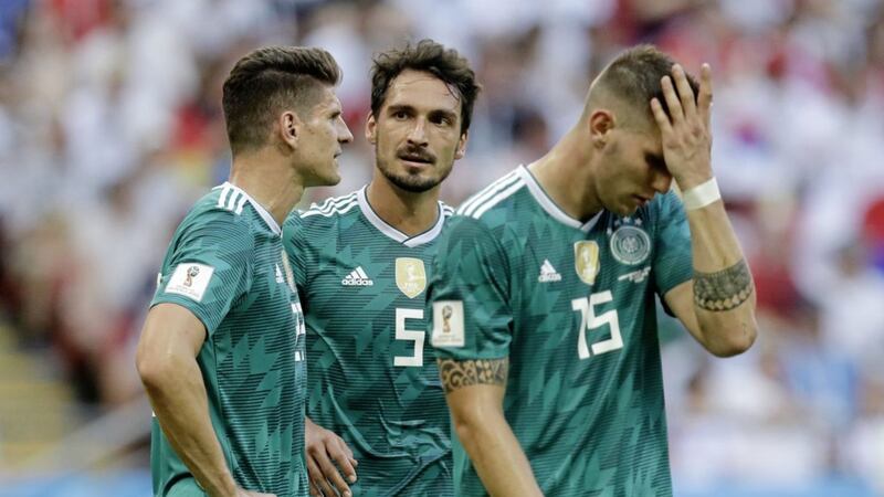Germany&#39;s Mario Gomez, Mats Hummels and Niklas Suele are dejected after their side&#39;s early World Cup exit 