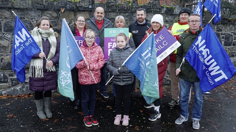 St Dominic&#39;s teaching staff &ndash; and young supporters &ndash; on the picket line in west Belfast during last week&#39;s strike action by teaching unions. PICTURE: MAL MCCANN 