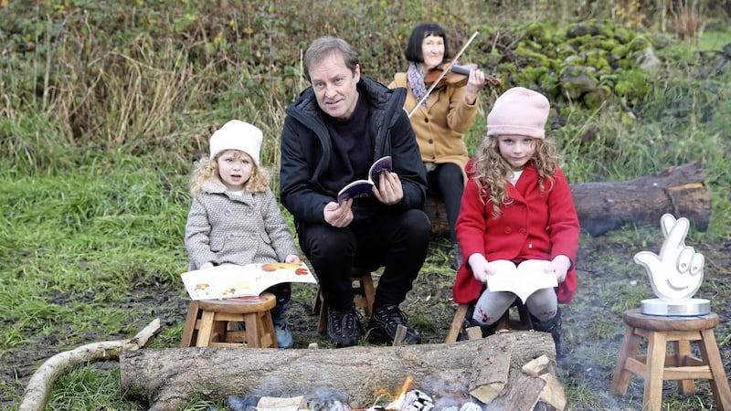 Father Ted star Ardal O&#39;Hanlon with young visitors Isabella and Lucia Smyth, and violinist Bernie Muckian, at An Tobar social farm and community wellness centre in south Armagh. Picture by Bill Smyth 