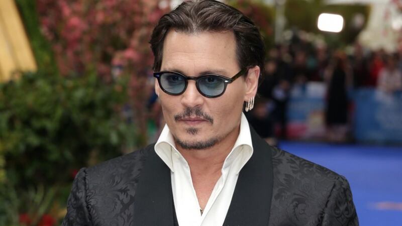 Johnny Depp sues former business managers for $25 million on day his divorce is finalised