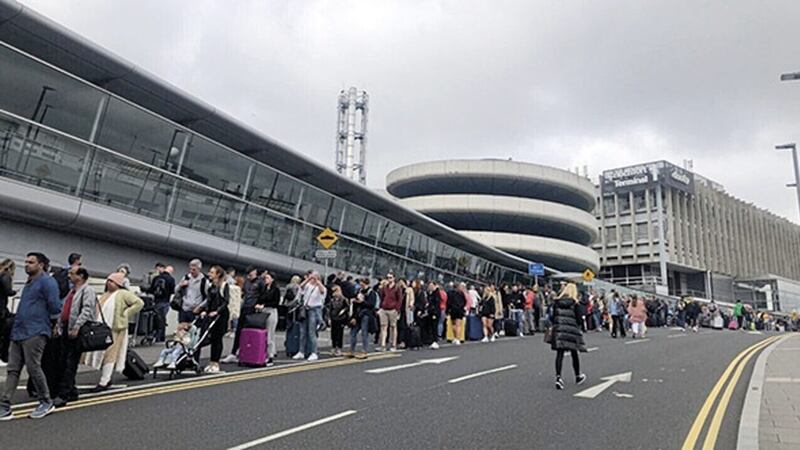 Lengthy queues outside Dublin Airport last weekend. Airport bosses have been told by the government to publish plans to manage the increase in traveller numbers this summer. Picture: RT&Eacute;