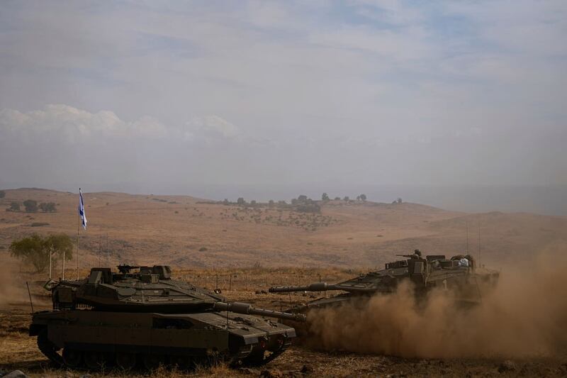 Israeli tanks stationed near the border with Lebanon 