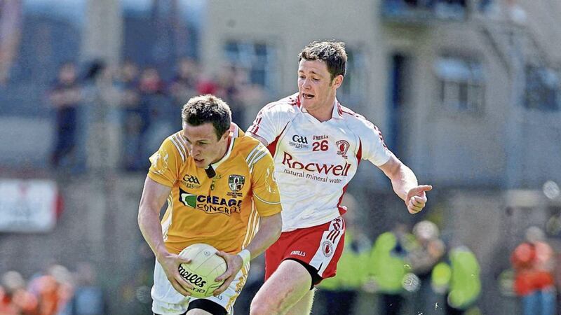 Enda McGinley keeps tabs on his brother-in-law Michael McCann during the 2009 Ulster final at Clones. A &lsquo;tackle&rsquo; by Enda on Michael&rsquo;s brother Tomas during the same game didn&rsquo;t go down well with Mrs McGinley &ndash; a sister of the Antrim duo Picture by Seamus Loughran 