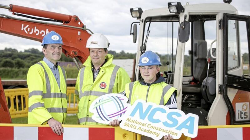 Jordan McGeown (16) from Lurgan gets ready for the first term of the new National Construction Skills Academy at ITS with Terry McCrum (Morrow Contracts) and Brendan Crealey (ITS). Photo: Brian Thompson 