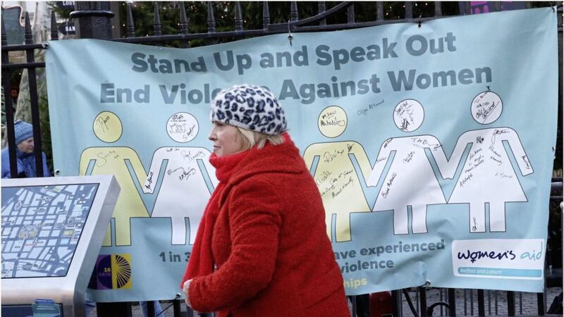 Women&#39;s Aid at Belfast city hall yesterday with a petition calling for the elimination of violence against women and children. Photo by Hugh Russell 