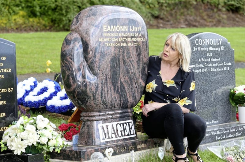Mary Magee beside her son Eamonn&#39;s headstone which they have been told to remove. Picture by Mal McCann 