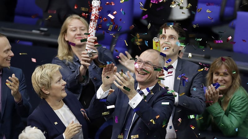Green Party's gay rights activist Volker Beck, front right, and fellow faction members celebrate with a confetti popper after German Federal Parliament, Bundestag, voted to legalize same-sex marriage in Berlin, Germany, Friday, June 30, 2017. (AP Photo/Michael Sohn)&nbsp;