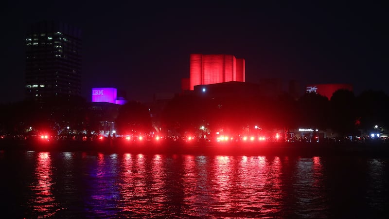Supporters lined the banks of the River Thames dressed in red.