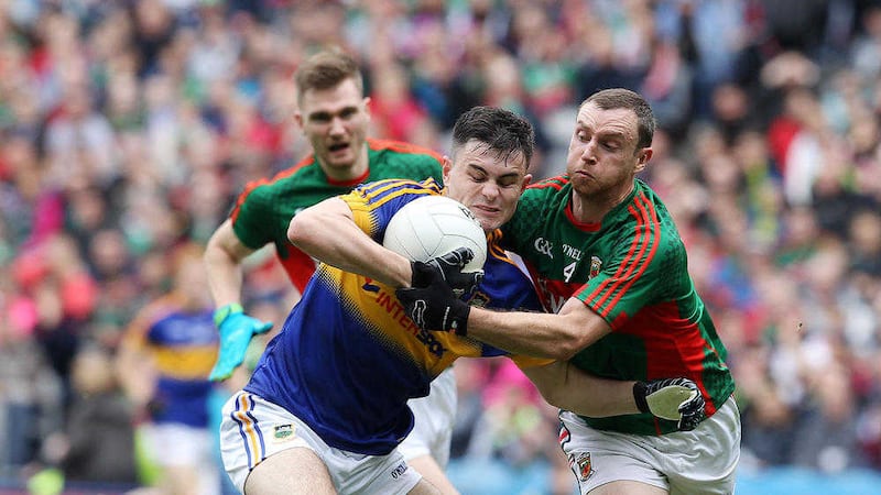 Michael Quinlivan tangles with Mayo's Keith Higgins during last Sunday's All-Ireland semi-final