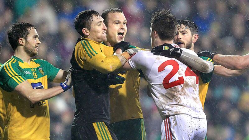 Donegal's Neil McGee puts out his tongue at Cathal McShane of Tyrone while Donegal keeper Mark Anthony McGinley, Cian Mulligan and Ryan McHugh step in during their NFL match at Ballybofey on Saturday night. Picture: Margaret McLaughlin&nbsp;