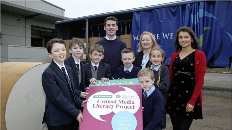 Finbar Burns BEd Celtic student at St Mary&#39;s University College, Donna Hazzard principal lecturer and Bronagh McCaughan, students&#39; union president with pupils from Aquinas Diocesan Grammar School and Good Shepherd PS 