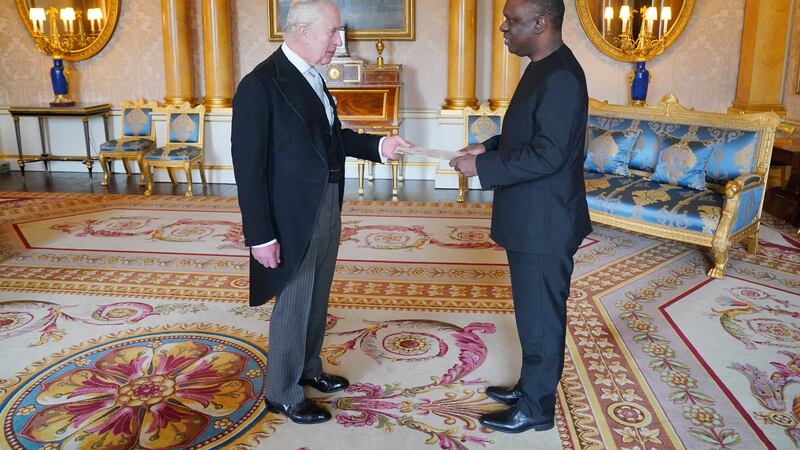 Tanzanian High Commissioner Mbelwa Kairuki presents his credentials to the King during a private audience at Buckingham Palace