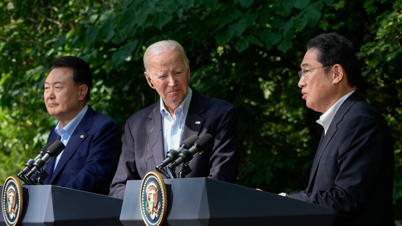 Japanese prime minister Fumio Kishida, right, speaks during a joint news conference with US President Joe Biden and South Korean President Yoon Suk Yeol (Alex Brandon/AP)