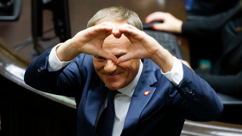 Donald Tusk shows a heart with his hands to lawmakers after he was elected as Poland’s Prime Minister (AP Photo/Michal Dyjuk)