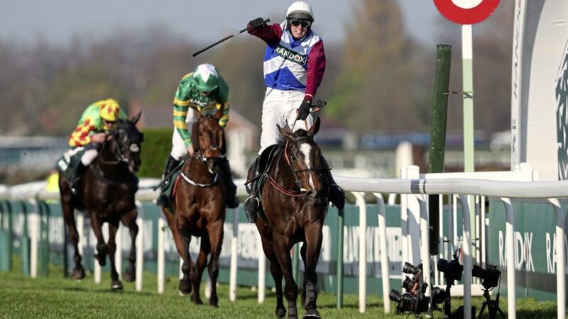 Derek Fox punches the air after guiding One For Arthur to victory in the Randox Grand National at Aintree on Saturday Picture: PA 