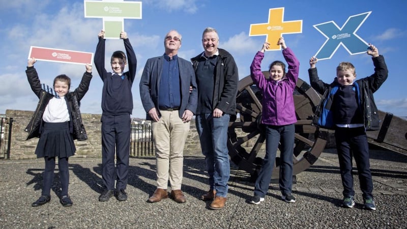Launching Children in Crossfire&#39;s Maths Challenge on Derry&#39;s Walls are Richard Moore,Franz Schlindwein and his children Saoirse, Lorcan, Orlagh and Franz. Picture by Lorcan Doherty 