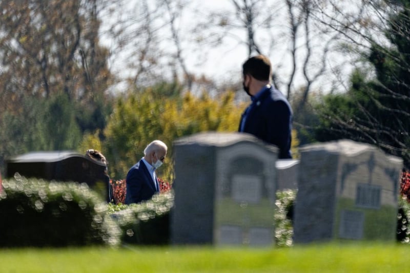 On Sunday, President-elect Joe Biden visited the cemetery where his son Beau, his wife Neilia, and daughter Naomi are buried at St Joseph on the Brandywine Catholic Church. Mr Biden carries Rosary beads given to him by Beau. Picture by AP Photo/Carolyn Kaster 