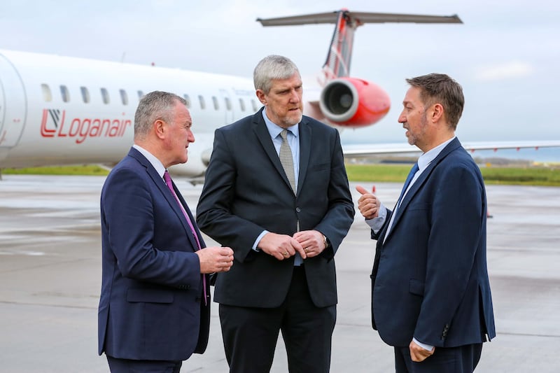 L-R: Economy Minister Conor Murphy and Infrastructure Minister John O’Dowd with Steve Frazer, managing director, City of Derry Airport, at the announcement of funding to protect the continuation of flights from the airport to London Heathrow.