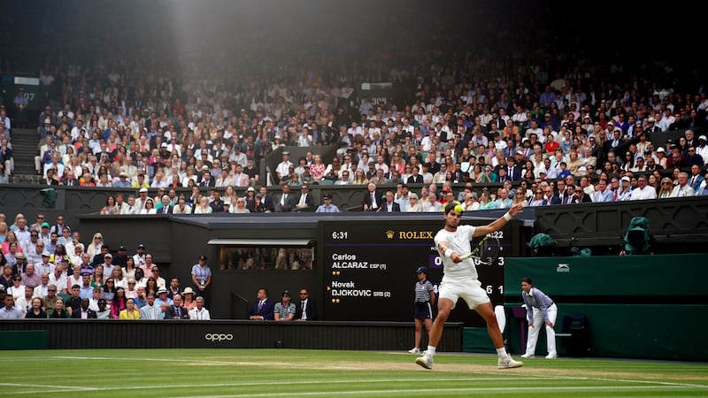 Carlos Alcaraz in action against Novak Djokovic in the men’s singles final in last year’s Wimbledon Championships