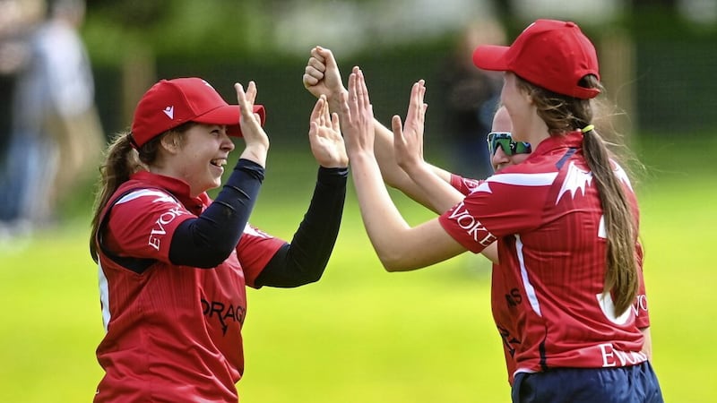 Cara Murray of Dragons, left, is congratulated by team-mates after catching out Gaby Lewis of Scorchers during the Evoke T20 Super Series 2023 match at Malahide Cricket Club.