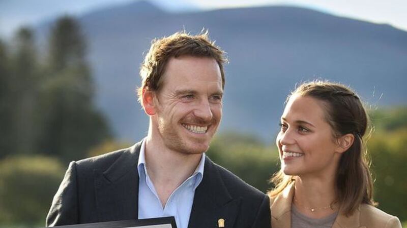Michael Fassbender and his partner Alicia Vikander celebrating after he was inducted into the Order of Innisfallen. Photo: Valerie O'Sullivan/PA Wire