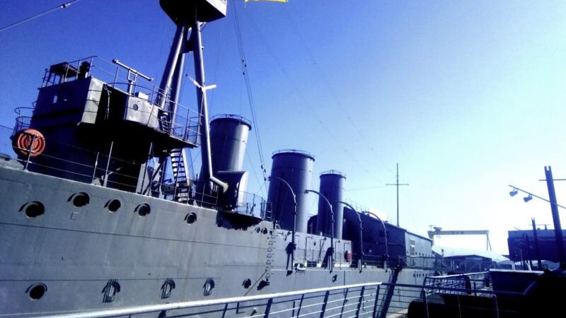 The Ukrainian flag being flown from HMS Caroline in the Titanic Quarter. Picture by Lise McGreevy 