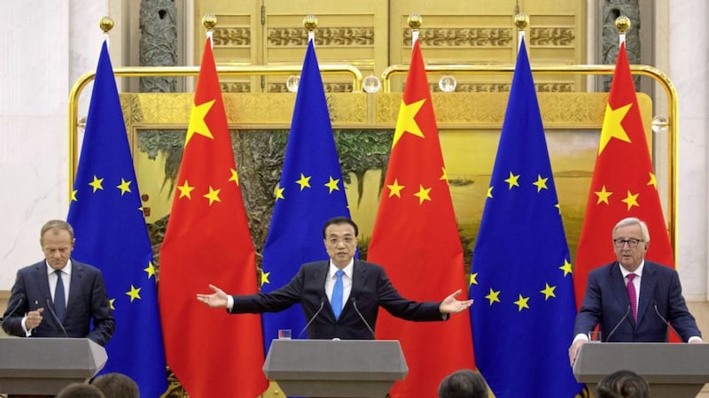 Chinese Premier Li Keqiang, center, gestures during a joint press conference with European Commission President Jean-Claude Juncker at right and European Council President Donald Tusk in Beijing on Monday. Picture by Ng Han Guan, Associated Press