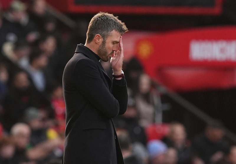 Michael Carrick appears dejected on the touchline