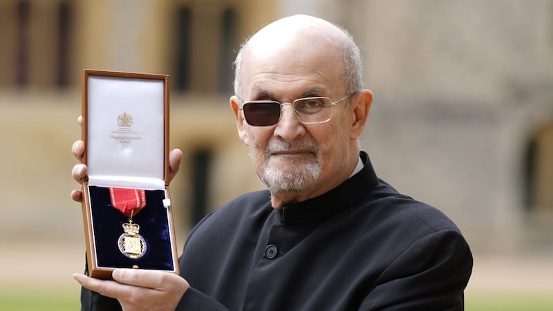 The writer was among those recognised at Windsor Castle as a Companion of Honour.