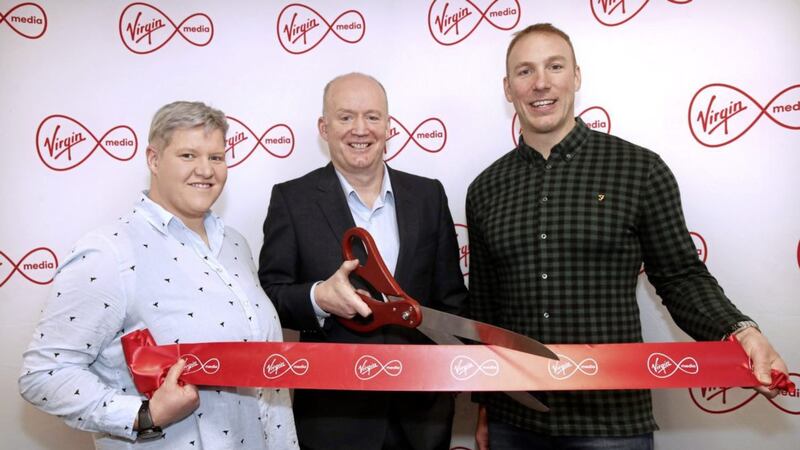 Ulster and Ireland&#39;s rugby players Ilse van Staden and Stephen Ferris with Tony Hanway, CEO of Virgin Media Ireland opening the new offices in Belfast. 