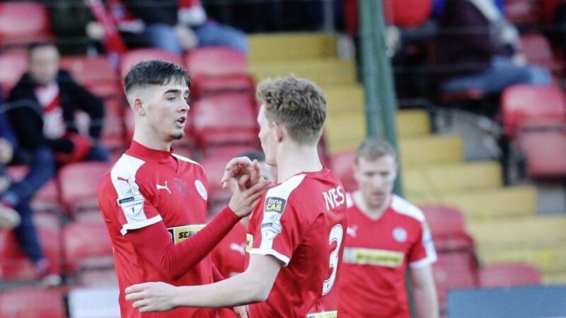 Jay Donnelly scored a treble for the Reds as they beat Knockbreda 6-0 in the Co Antrim Shield